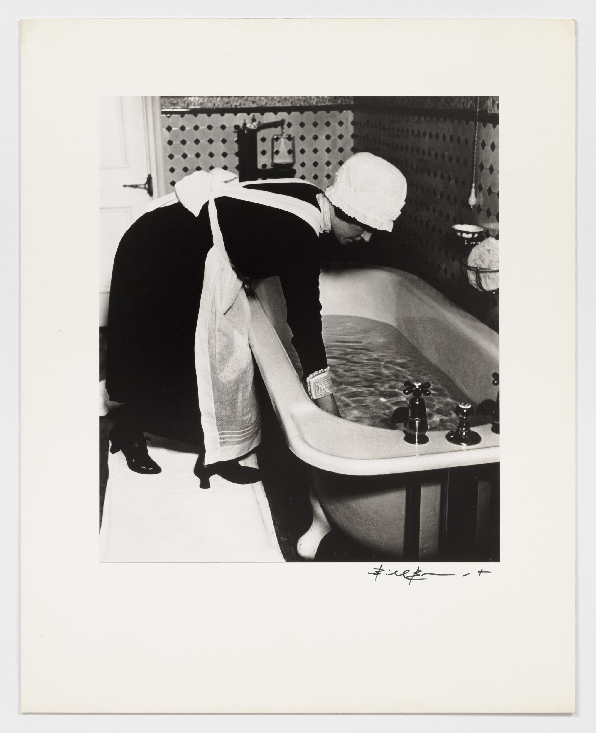 Parlourmaid preparing a bath before dinner - Photograph by Bill Brandt