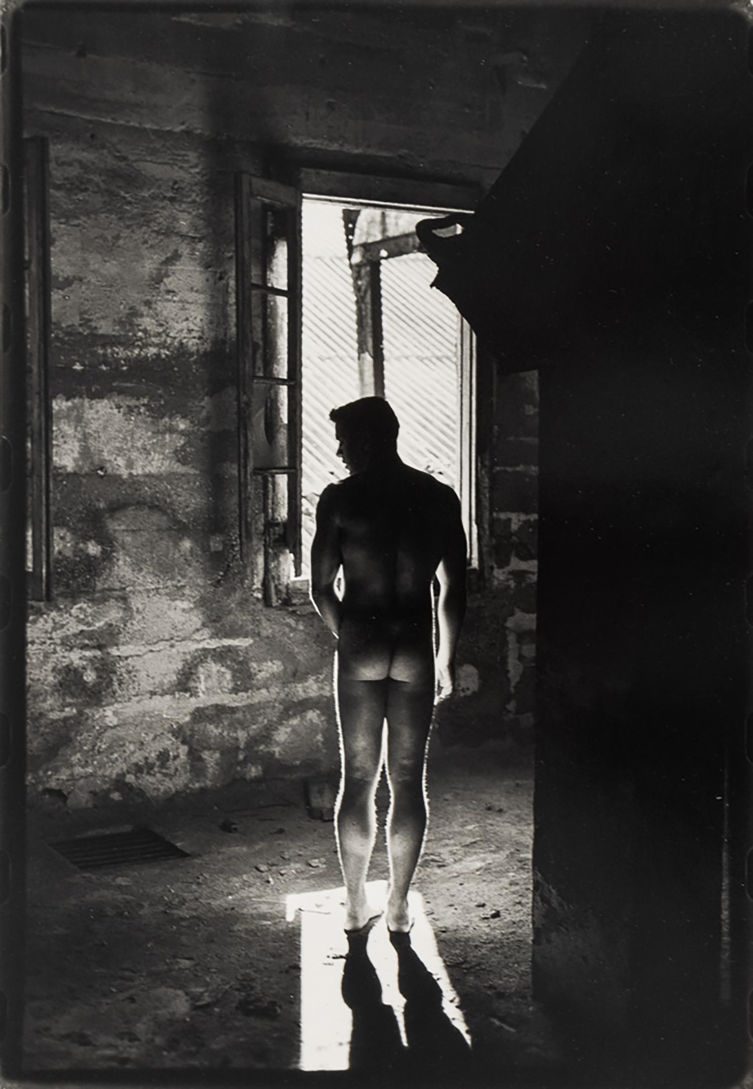 Untitled (Nude Male Standing in Front of Window from Behind) - Photograph by Bill Costa