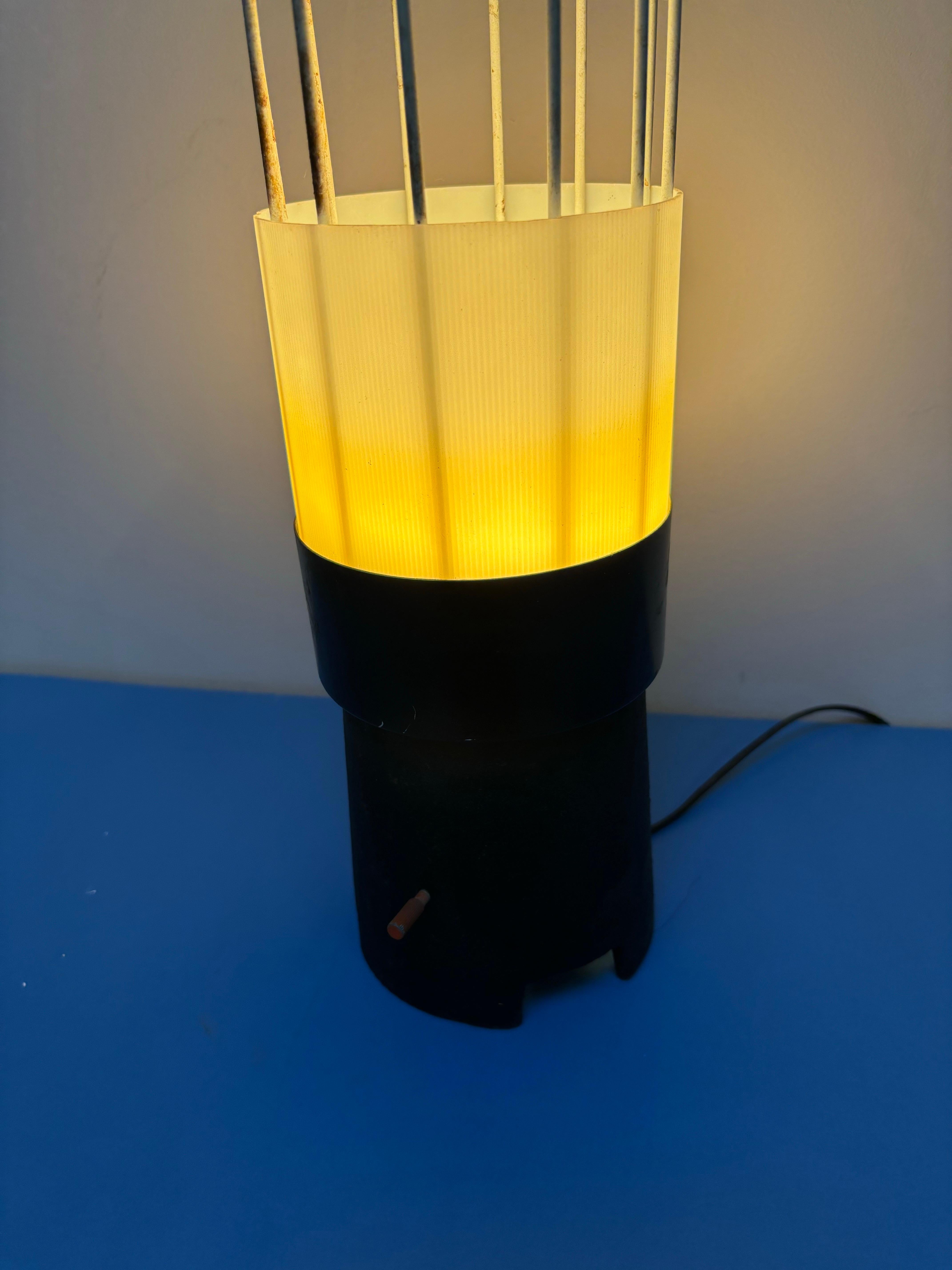 Bill Curry Whimsical Cattail Table or Floor Lamp for Design Line.  Not often seen, this unique Lamp is somewhat of a departure for his simple understated designs.  Bright colored wood Cattails add a great flair to this Lamp!  Switch on Metal Base.