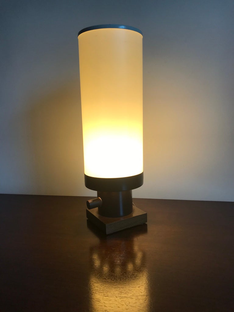 California design 
appears to be a custom or experimental design
plastic cylinder shade enameled steel and walnut base with walnut switch
original wiring and condition 
great for intimate lighting or as an accent piece.
 