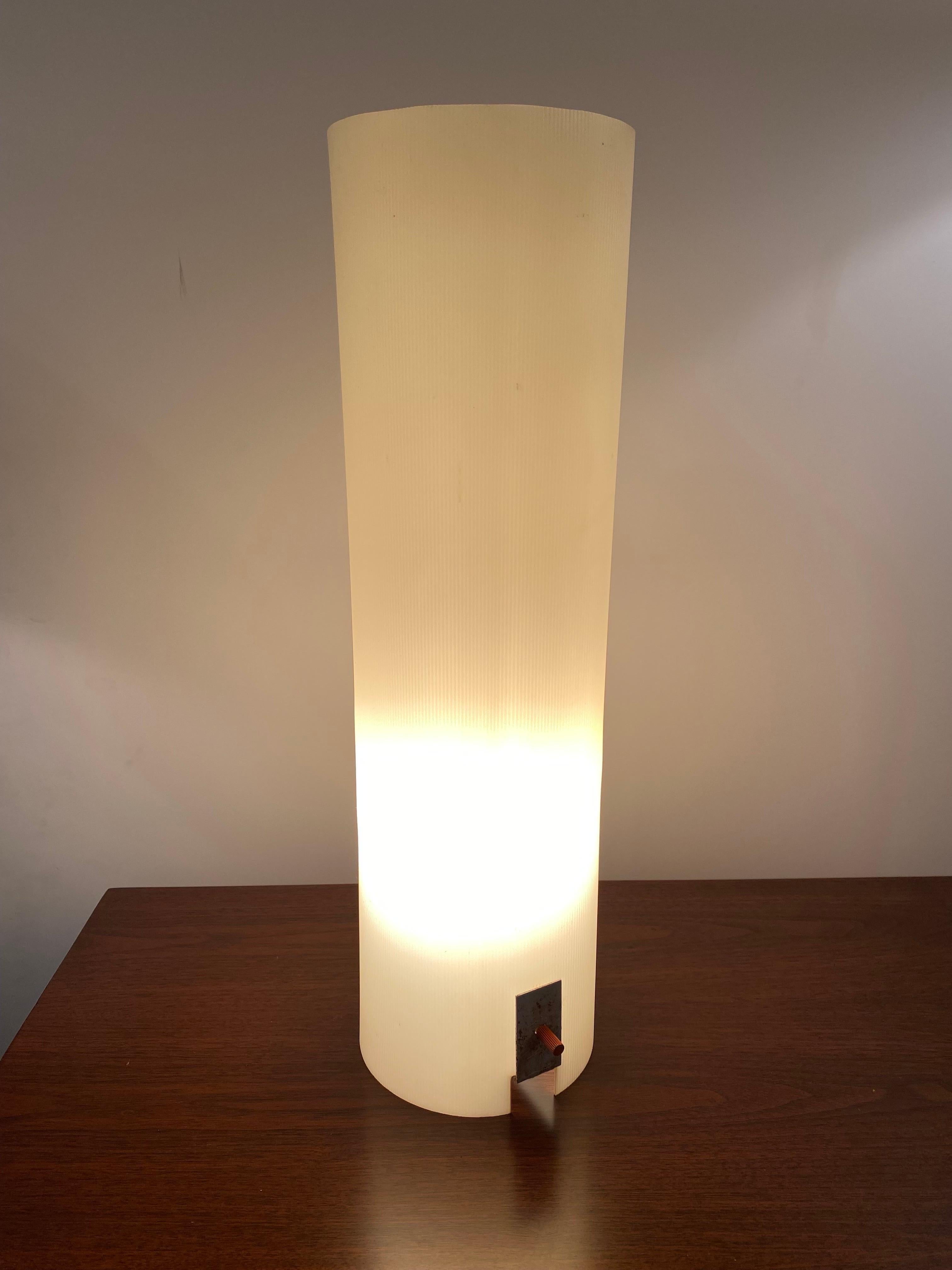 Minimalist lamp by Bill Curry for his company, Design Line. Designed and manufactured in El Segundo, CA in the 1960s. Hard extruded ribbed plastic with enameled white metal frame. The lamp is luminous when lit.  Three way switch.

Bill Curry's work