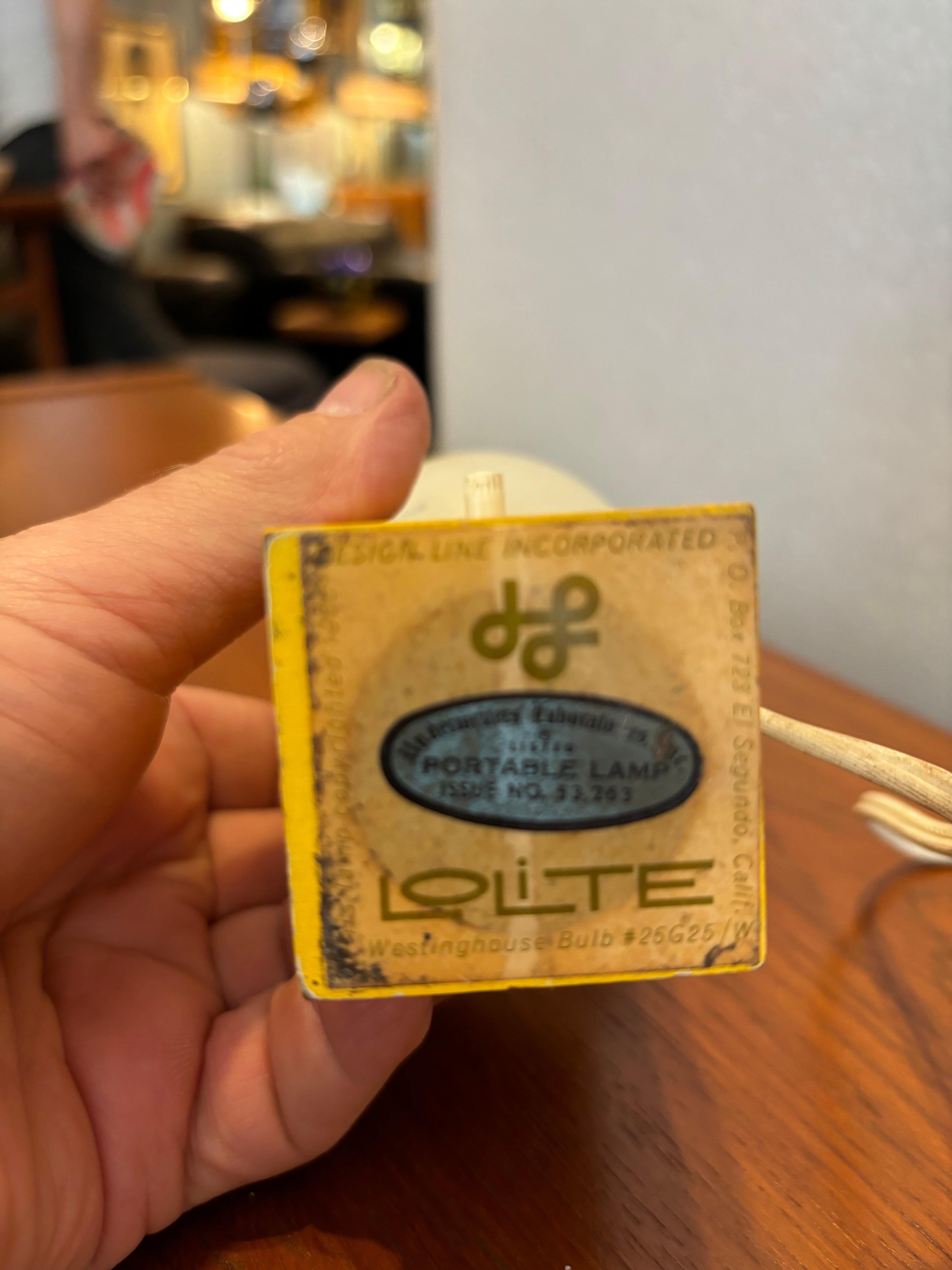 Set of 3 Lo Lite for Design Line Table top accent lights.  Designed in late 1950's.  Little guys are seldom seen!  Wood bodies with a push-through switch.  One black body and two yellow bodies make up the set.