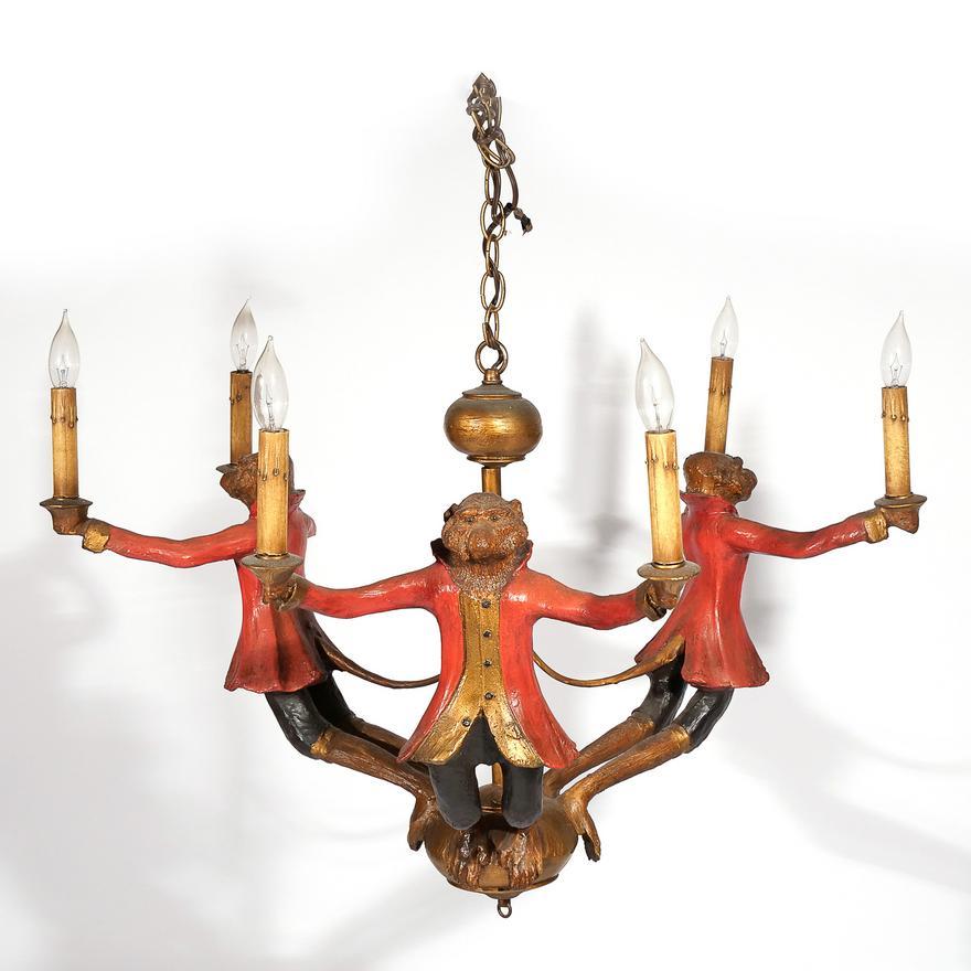 Bill Huebbe (1929-2013) monkey form chandelier.
Designed as three monkeys in red coats each holding two candles (electrified) stamped and dated 1996.