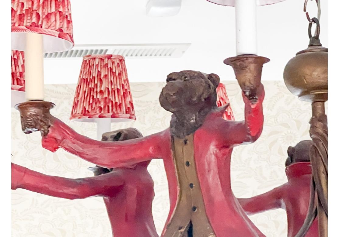 American Bill Huebbe Designs Ten Light Chandelier In The Form Of Monkeys In Red Coats For Sale