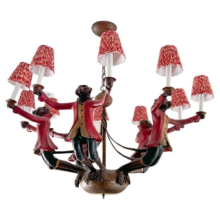 Bill Huebbe Designs Ten Light Chandelier In The Form Of Monkeys In Red Coats For Sale