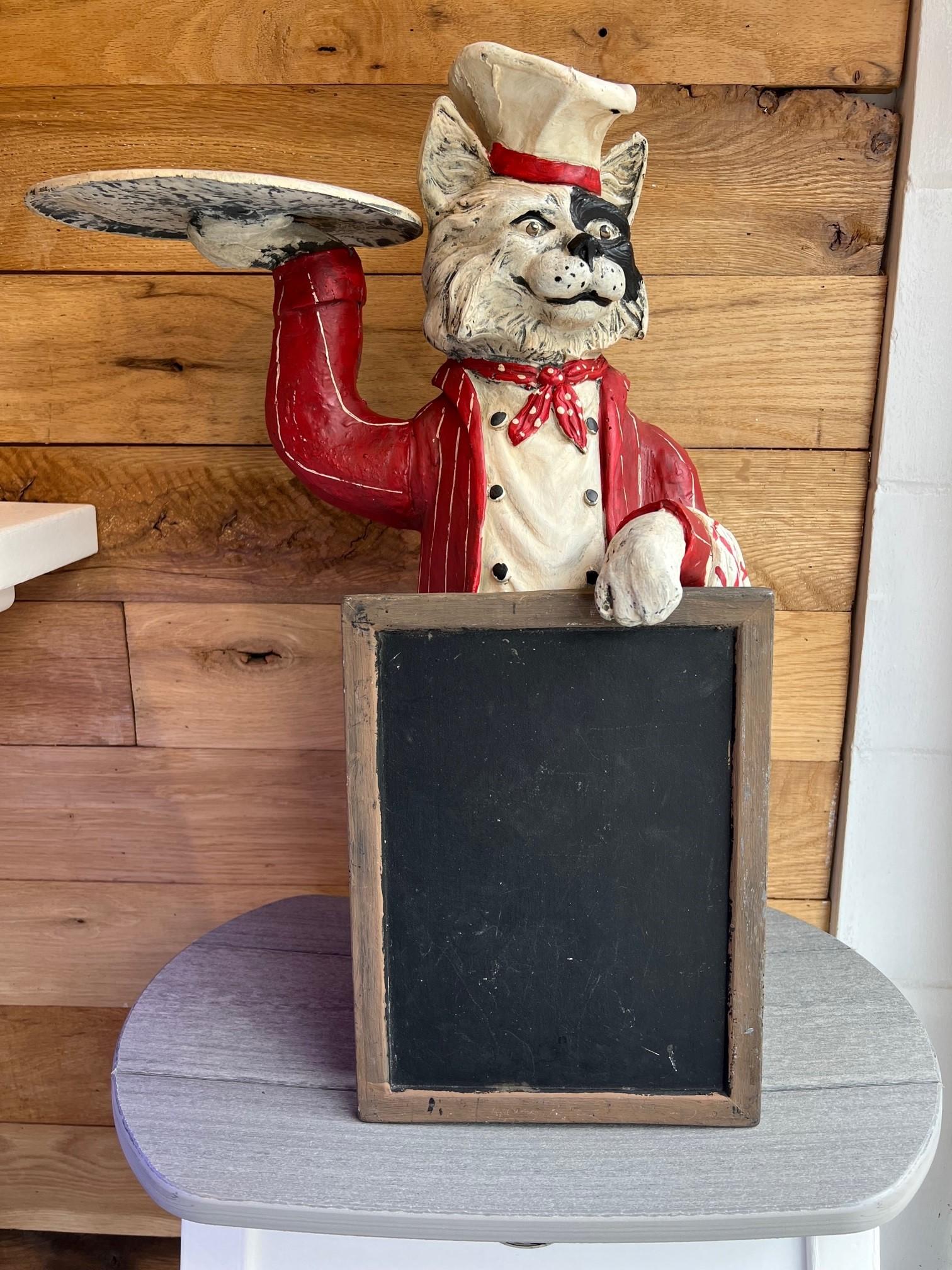 Rare Bill Huebbe Chef Cat with menu chalkboard signed HUEBBE 1992. This is a fun whimsical piece by Bill Huebbe made of fiberglass and hand painted. Bill was a creative artist who was known for his famous monkey chandeliers and his many chef animal