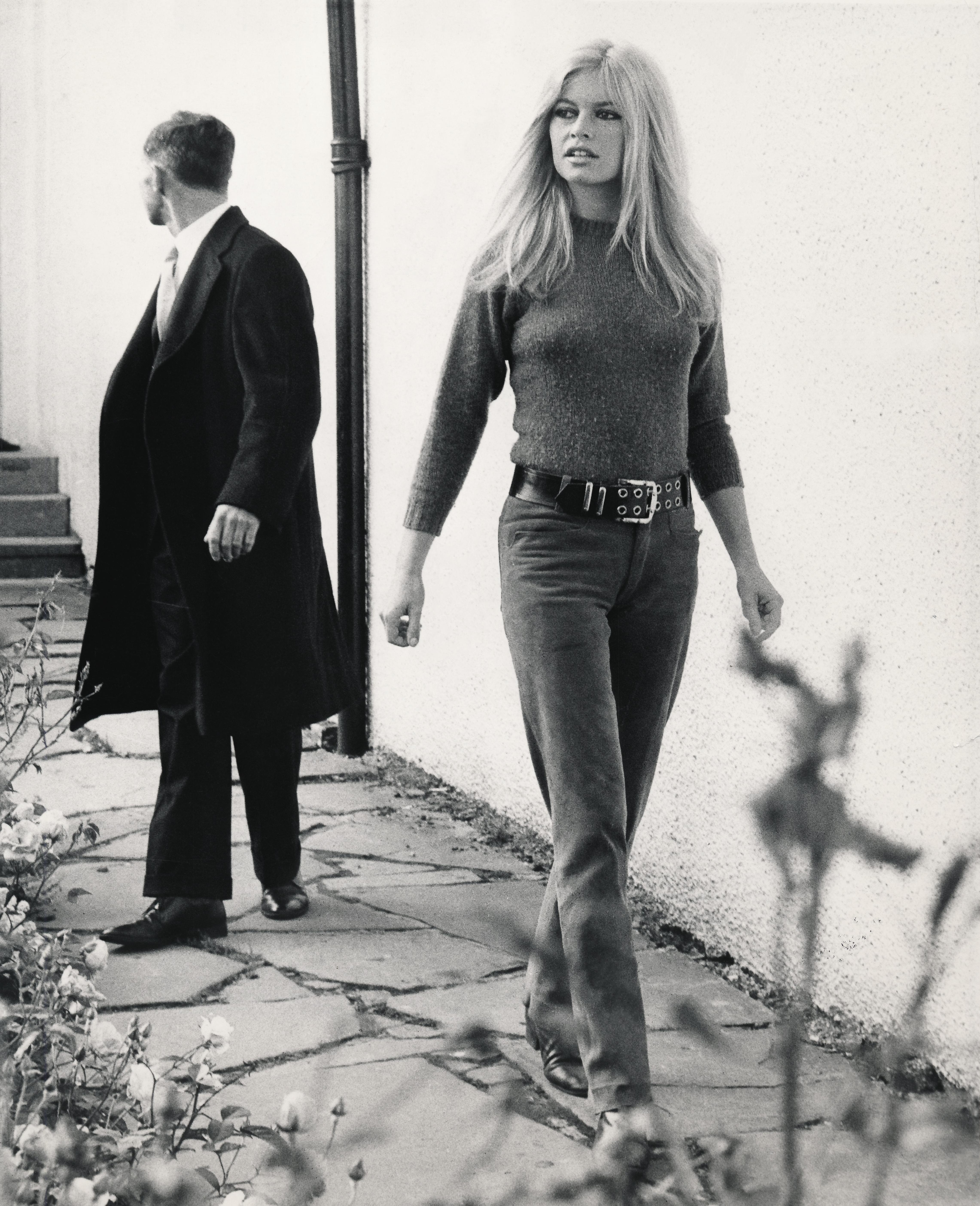 Bill Kobrin Black and White Photograph - Brigitte Bardot Walking Candid in Blue Jeans Globe Photos Fine Art Print