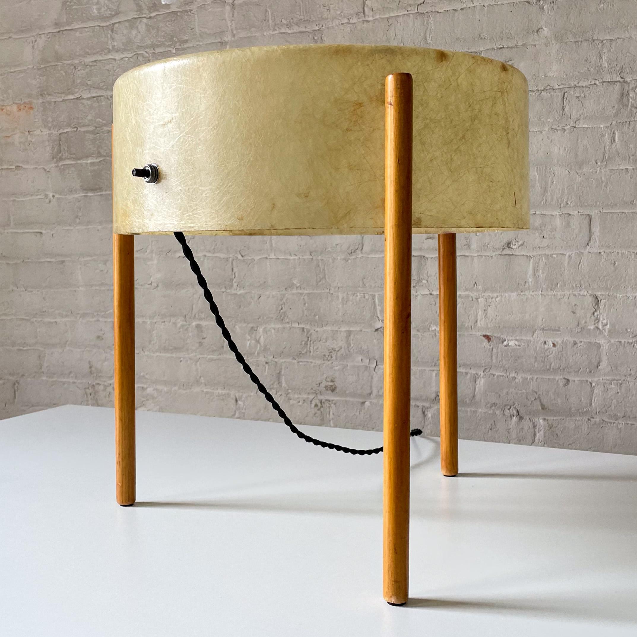 Drum-shaped lite table of molded iberglass mounted on three solid birch legs, designed and produced circa 1950 by Asian/American architectural lighting designer Bill Lam. William M.C. (Bill) Lam (1924-2012) was born and raised in Hawaii, entering