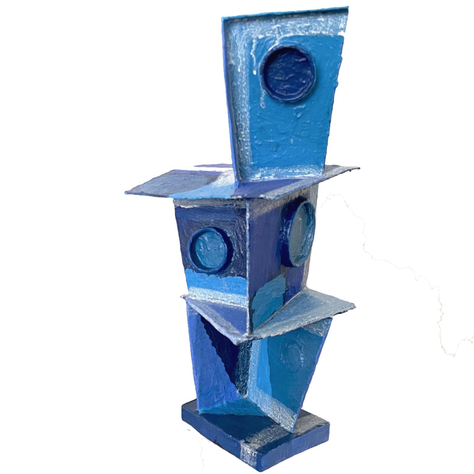 Cubist style abstract mixed-media sculpture titled 'Blue Tone Tower' was created using various materials including wood, papier-mache, and paint by  Bill Low (Scotland 1898-1980). Beautiful cubist style painting in vibrant blues painted onto paper