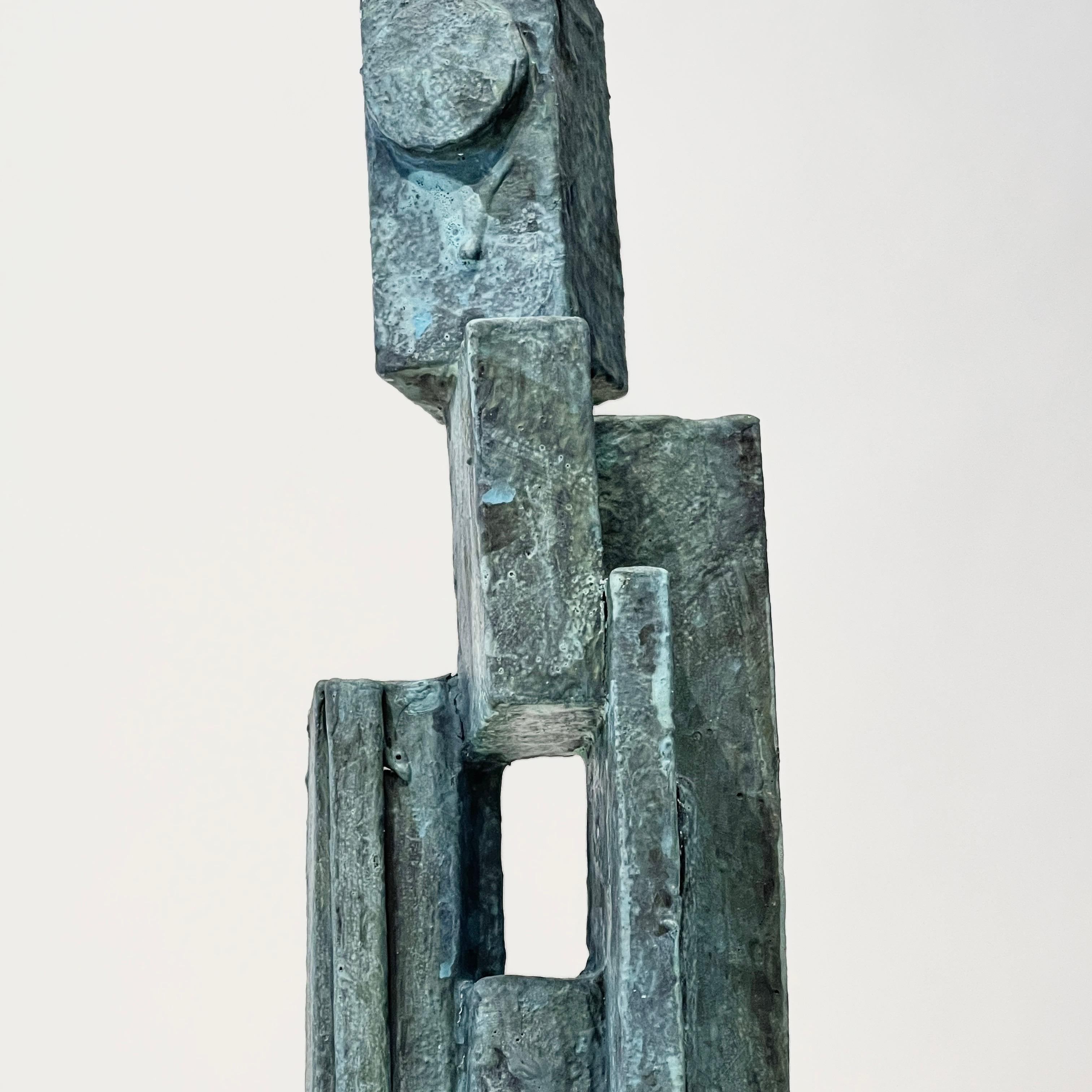 Cubist abstract mixed-media sculpture was created using various materials including wood, papier-mache, and paint. Beautiful weathered bronze verdigris effect surface.