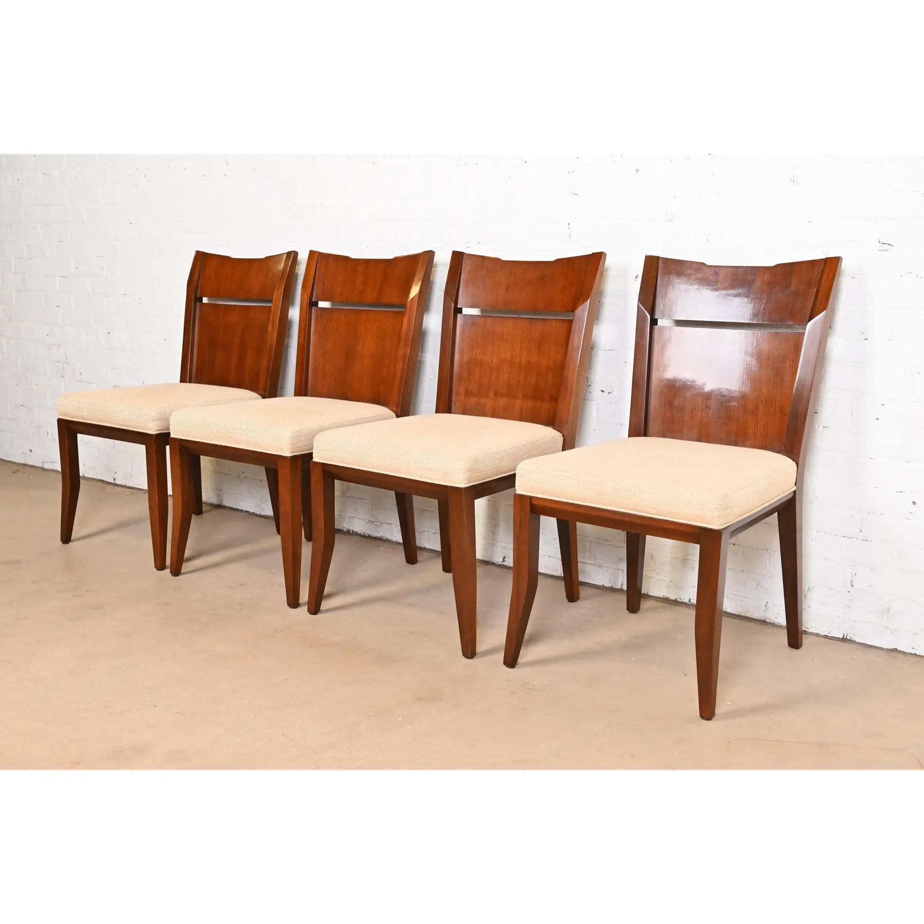 A gorgeous set of four Modern dining chairs

By Bill Sofield for Baker Furniture

USA, Early 21st Century

Solid carved walnut, with upholstered seats.

Measures: 20.13