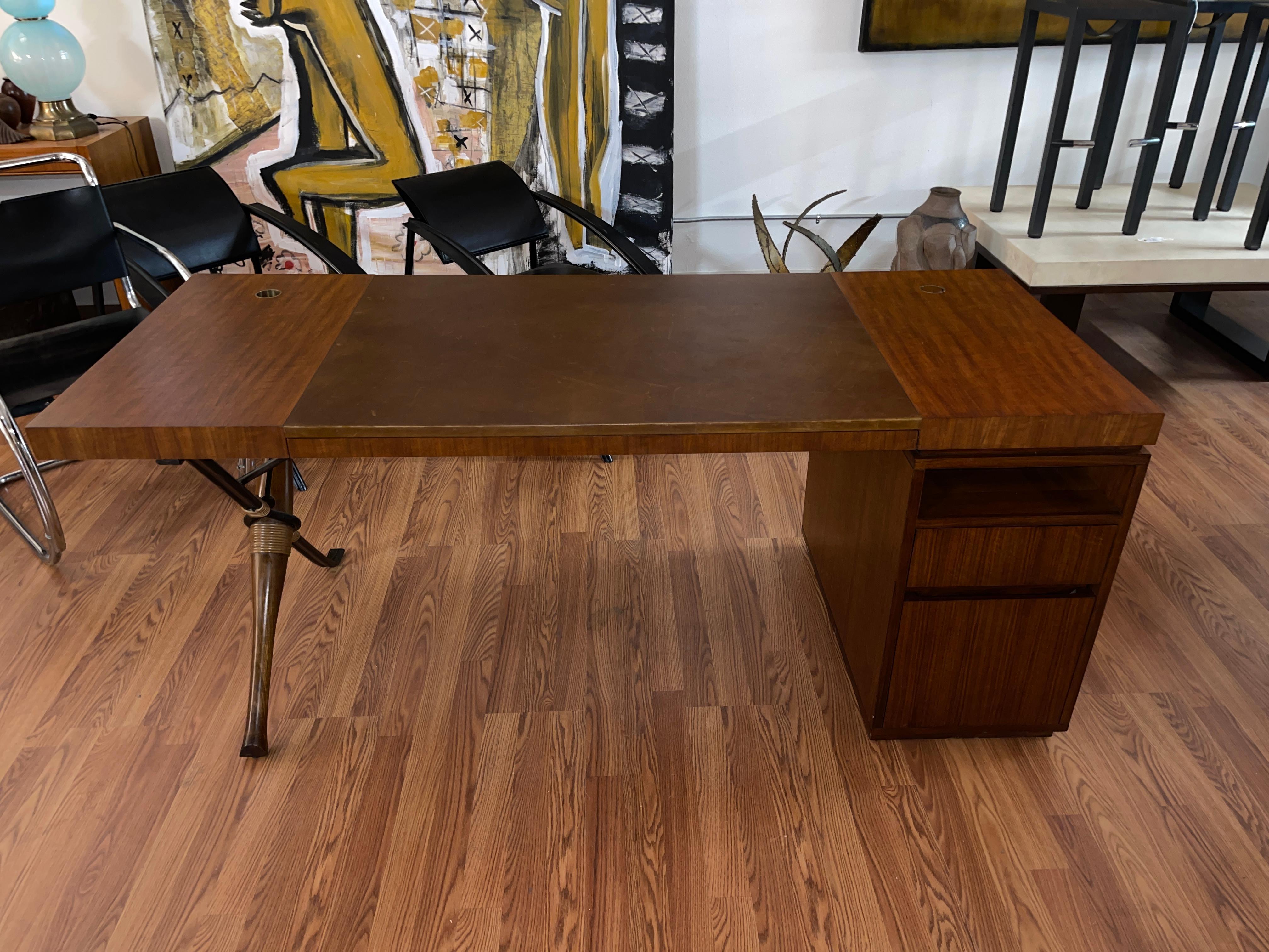 Beautiful Baton Desk or writing table designed by Bill Sofield for McGuire / Baker. 
Leather insert on top. Three drawers on one side and a storage spot on the other. Can be used as a partners desk as seen in the last photo, where it’s pictured
