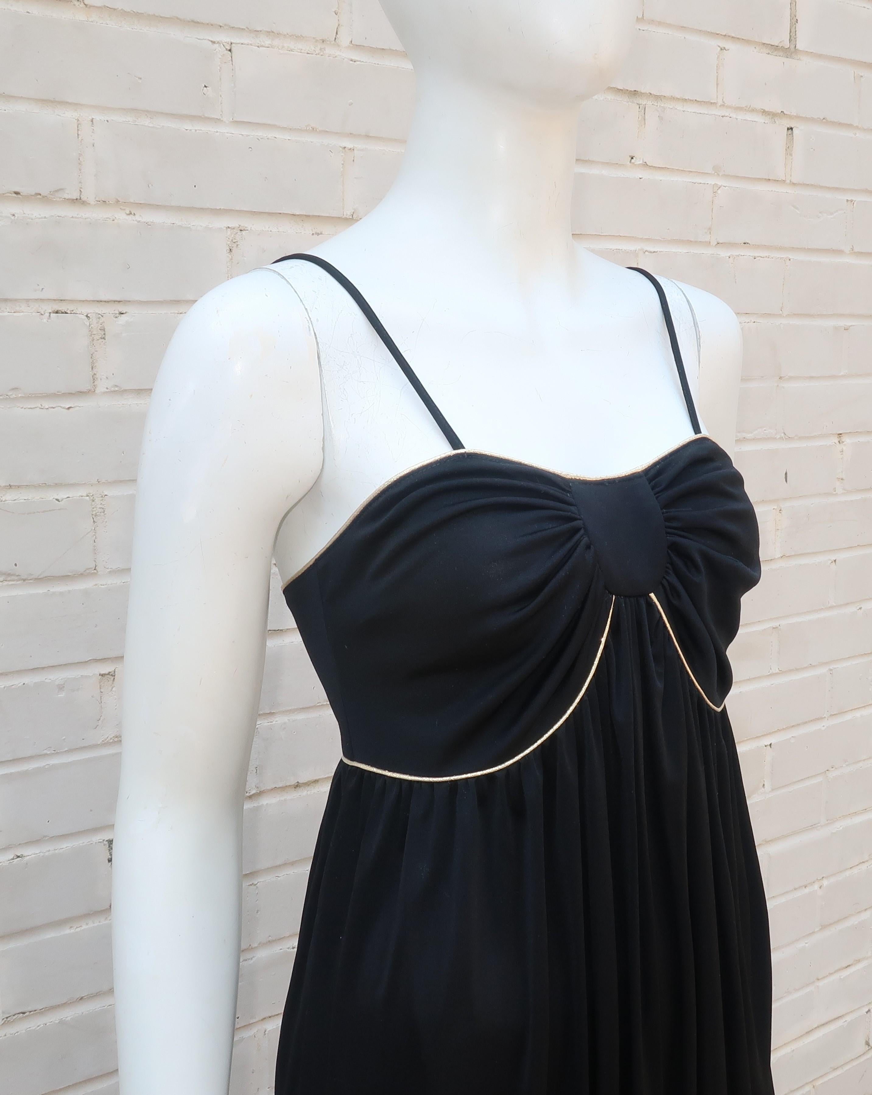 Bill Tice was an innovative American designer specializing in lingerie and hostess wear that was as glamorous at home as it was out on the town.  This black polyester jersey slip dress can do double duty as a sexy stay-at-home lounger or