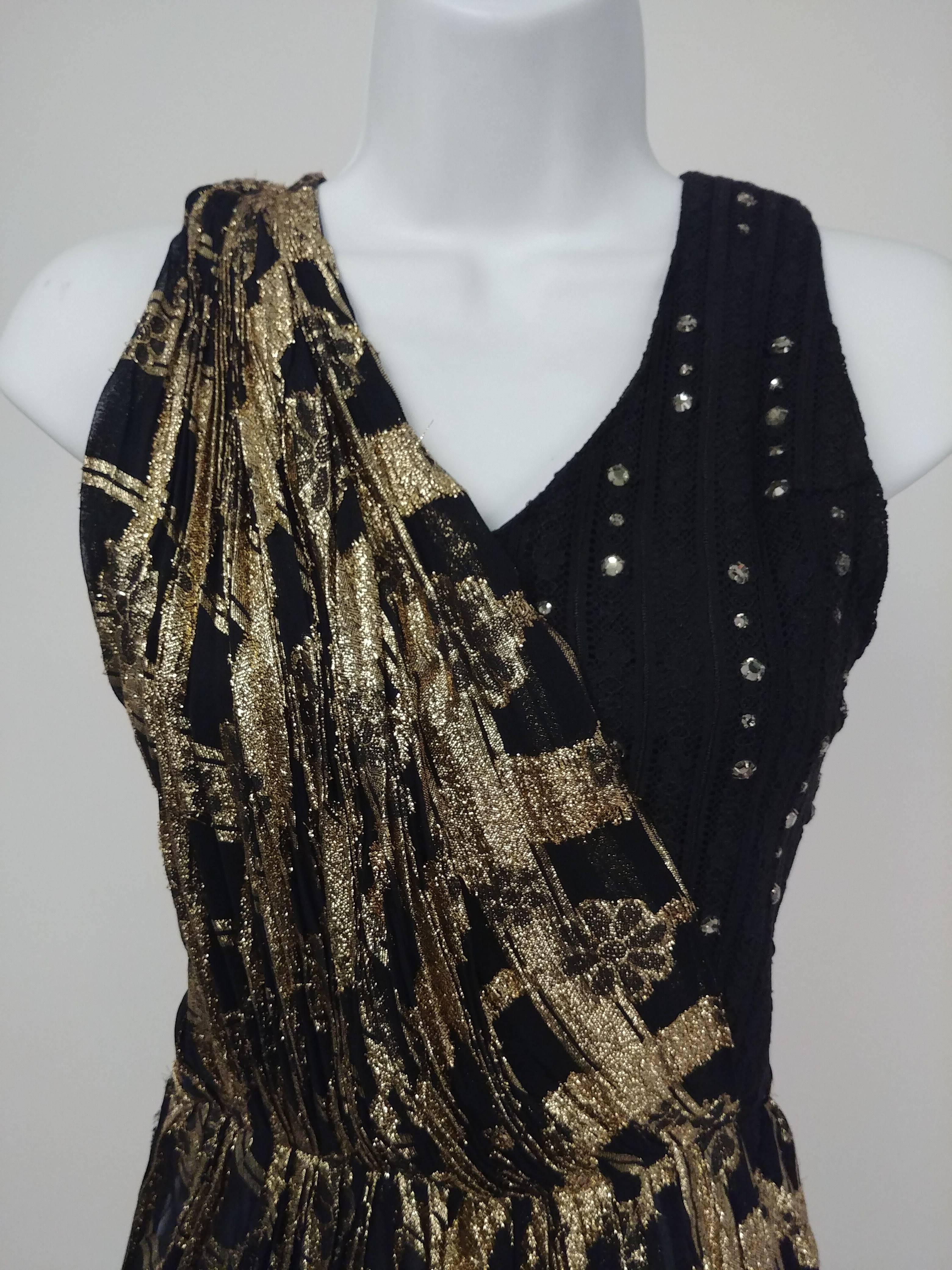Bill Whitten's Workroom 27 Gold Metallic & Rhinestone Stage Costume Top. Stage piece by famed costumer Bill Whitten consists of draped gold lamé with asymmetric pleated hem over black textured knit embellished with rhinestones. Zips up side. 
