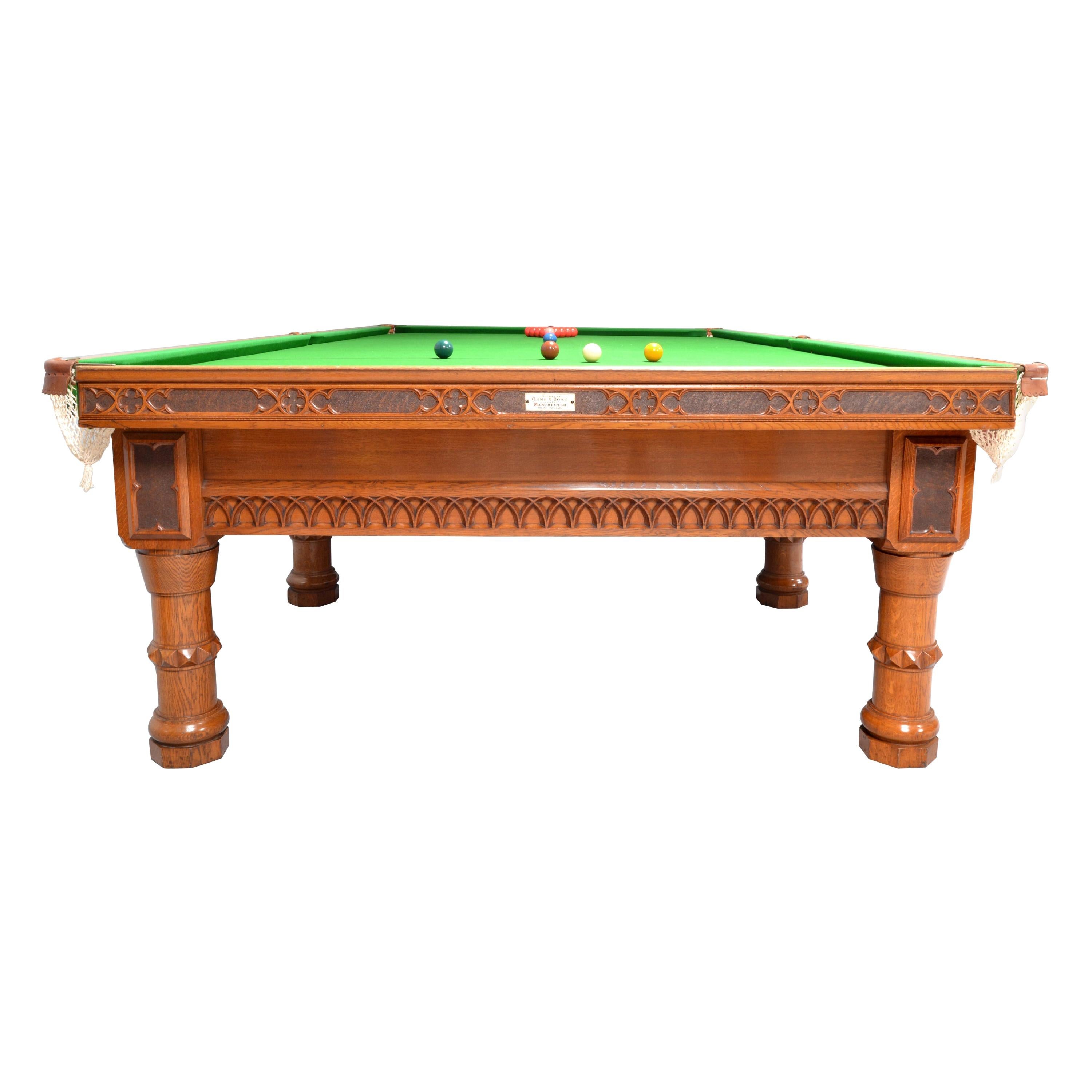 Billiard Snooker gothic revival form antique table by Orme of Manchester circa 1860, an unusual and unique design solid oak construction with tracery decoration to the frame, the cushion edges embellished with stipple carving, supported by eight
