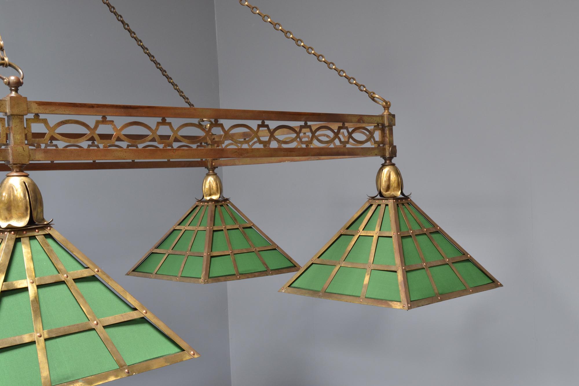 A spectacular brass framed antique billiard or snooker table light, made by 'The Original Burroughes & Watts' of London, circa 1895.

A decorative pierced frame with applied bosses on each corner, supported by handmade brass chains which are