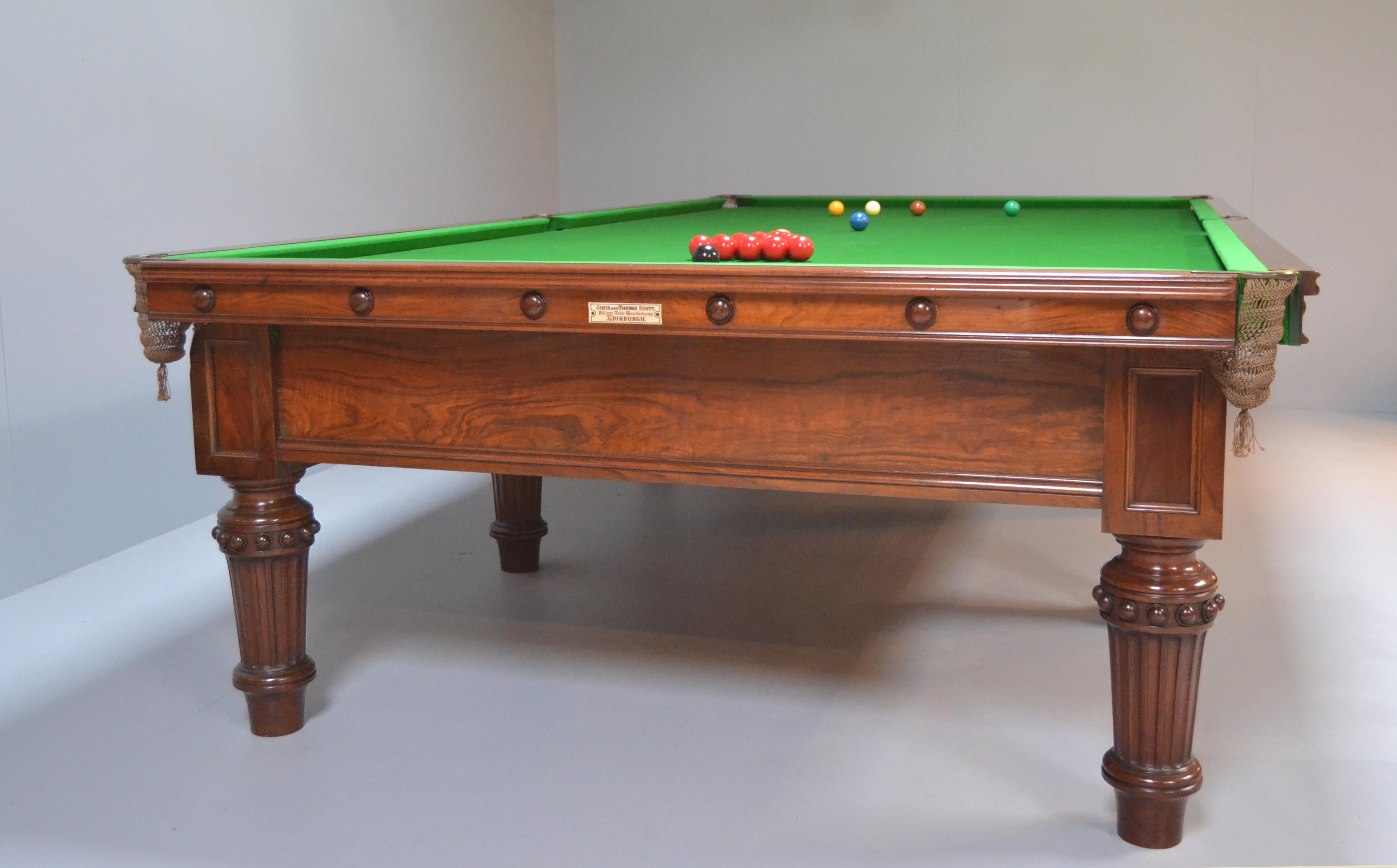 This beautiful full size Country House Billiard - Snooker table was made circa 1870 by J & T Scott of Edinburgh, it is a superb cut of figured walnut and exudes both quality and presence. 

Standing on eight elegant shaped and fluted legs with