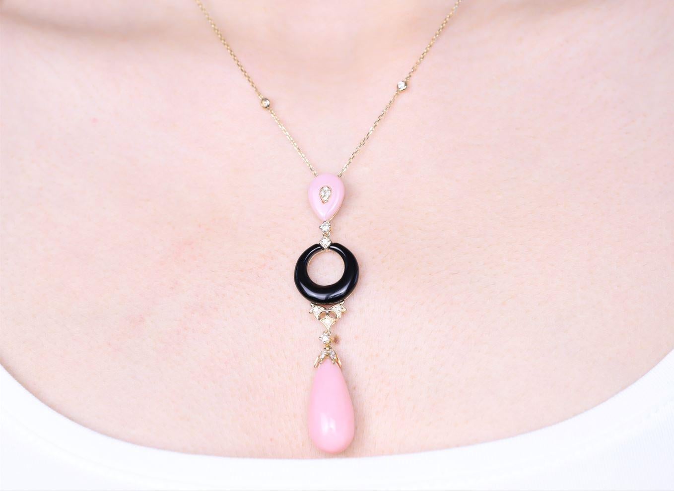Decorate yourself in elegance with this Necklace is crafted from 14-karat Yellow Gold by Gin & Grace. This Necklace is made up of Pink Opal Pear-Cut (2 pcs) 14.78 carat, Onyx (1 pcs) 3.52 carat, and Round-cut White Diamond (18 Pcs) 0.31 Carat. This