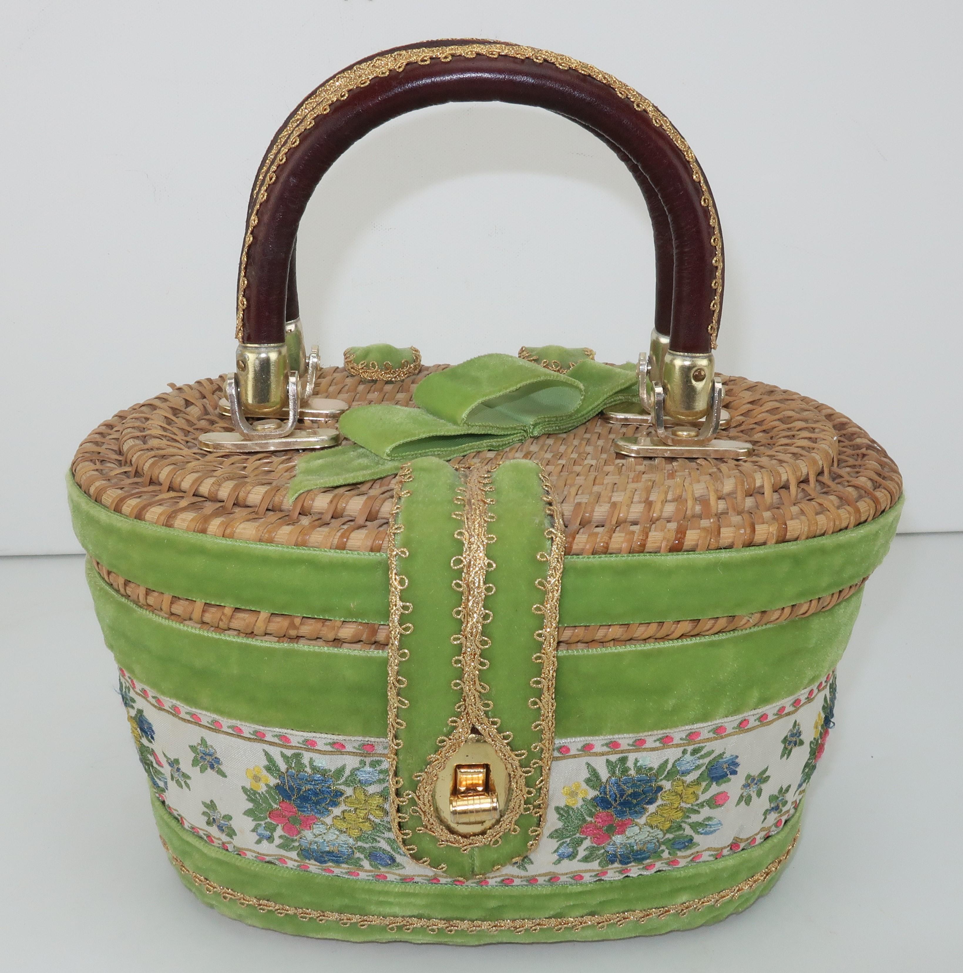 1960’s Billie Ross of the Palm Beaches wicker basket handbag with whimsical brocade and velvet ribbon embellishments incorporating shades of lime green, hot pink, yellow, gold and blue.  The bag has double leather covered top handles and a turn lock