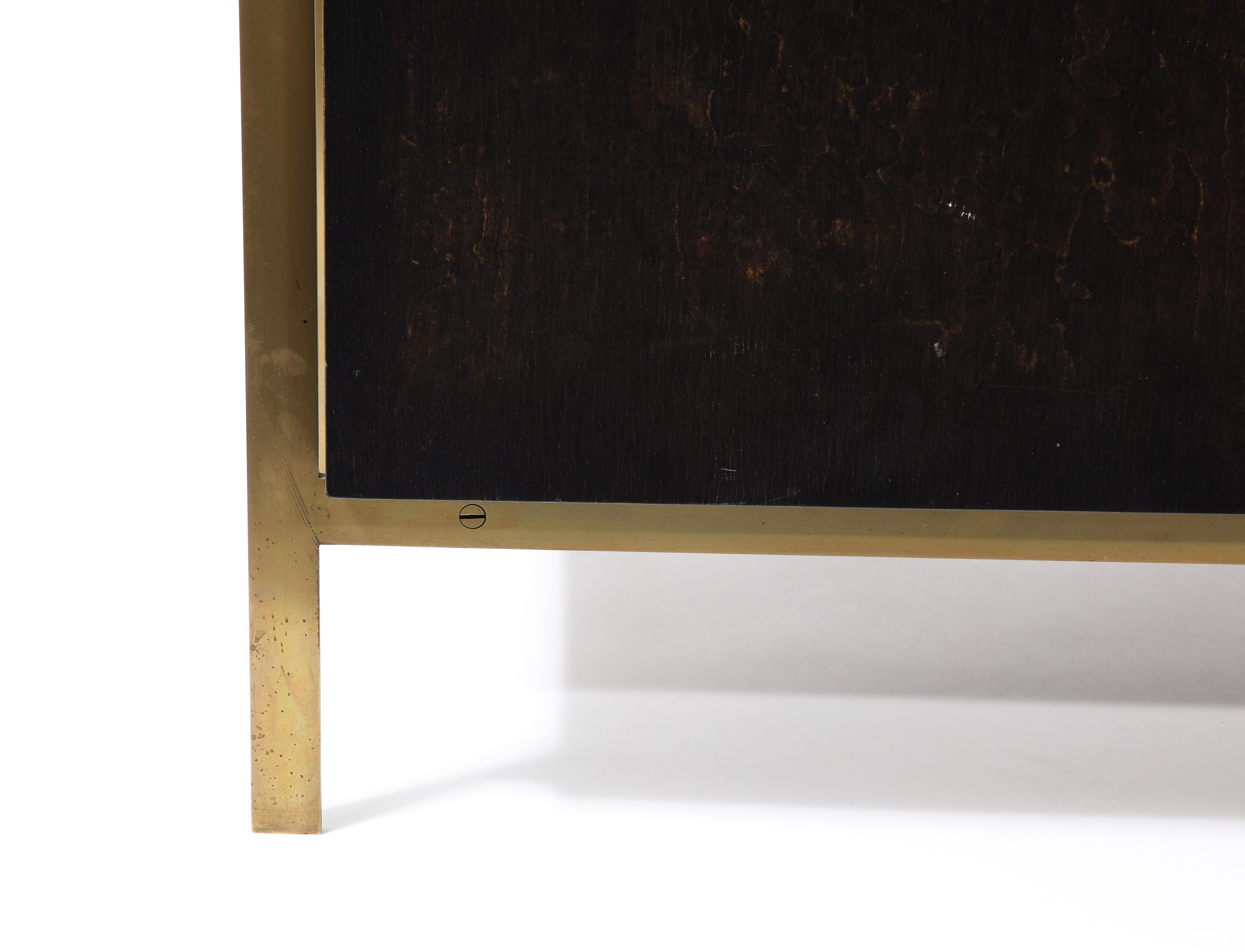 Part of a collection of furniture by Billy Cotton formerly represented by FERRER. Elegant classic modern lines. Dark veneer exterior. Patinated brass frame. Dark lacquered interior. 