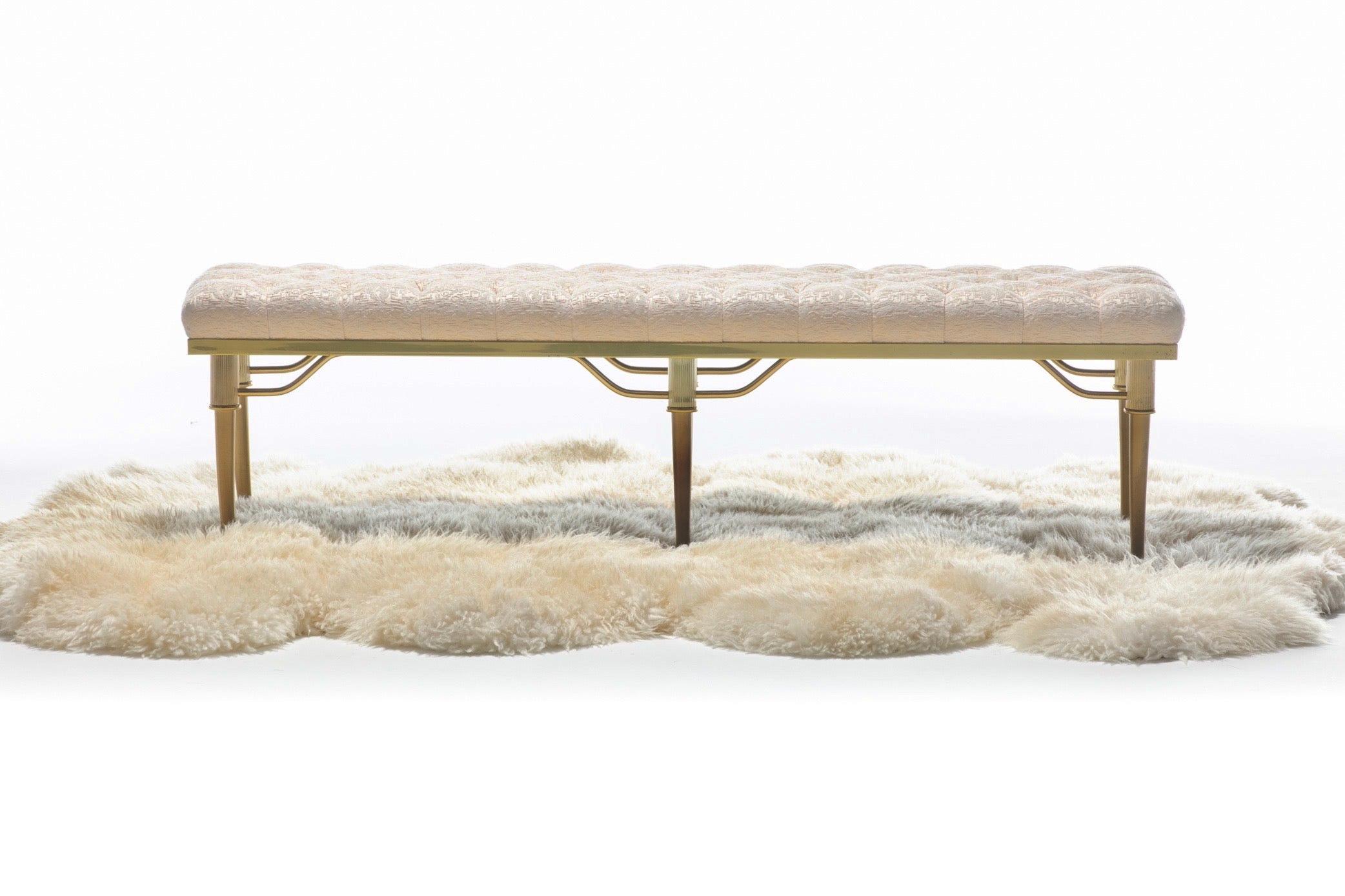 No one did brass seating better than Billy Haines and this 1960s Klismos bench - sourced in Los Angeles of course - is a fine example of his work with splayed brass legs and a heavily tufted ivory seat. Celebrity actor turned celebrity designer,