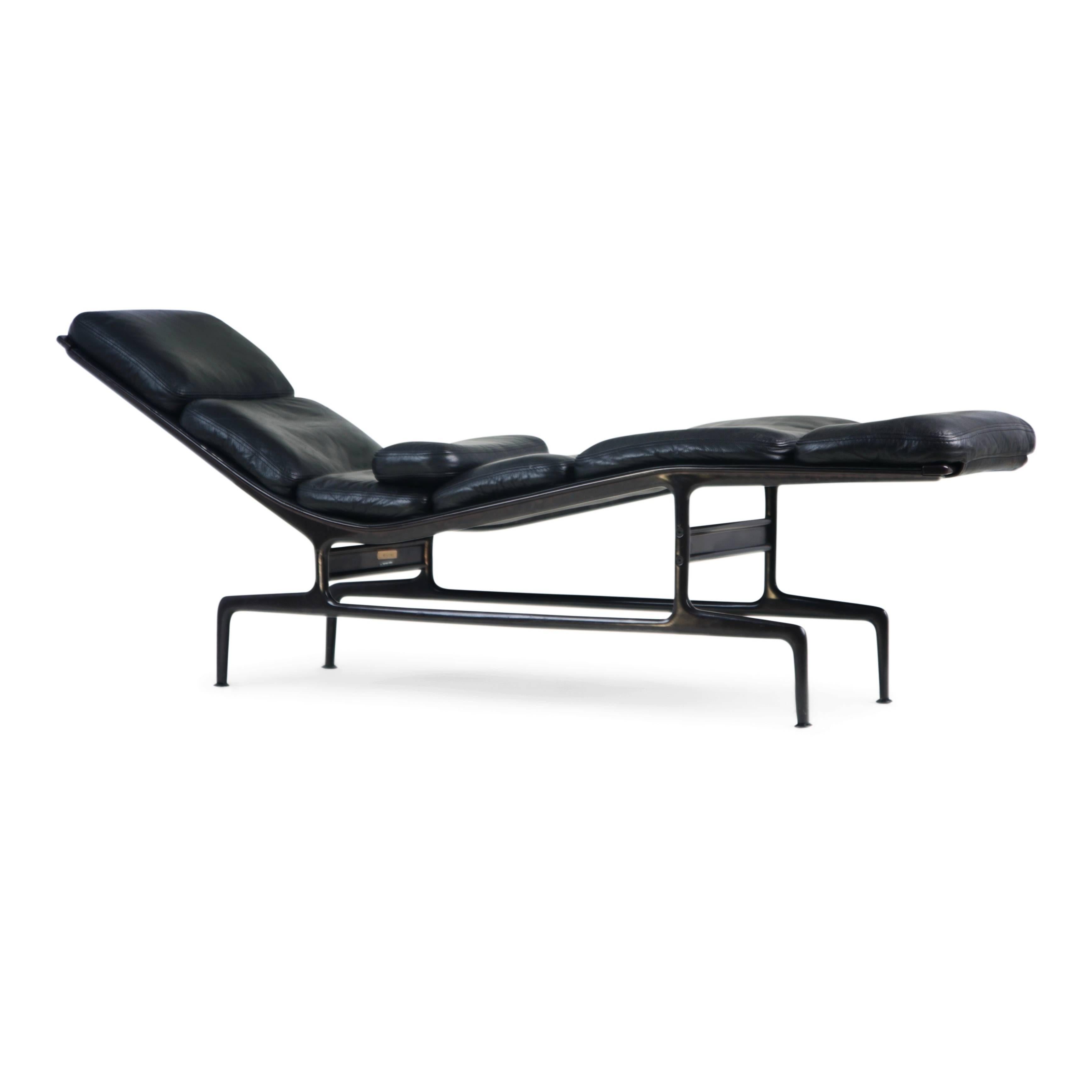 A handsome and well cared for example of the Billy Wilder chaise longue by Ray and Charles Eames for Herman Miller. In soft and supple high-quality black leather on a charcoal grey base. This example produced in 1988, with attached Herman Miller