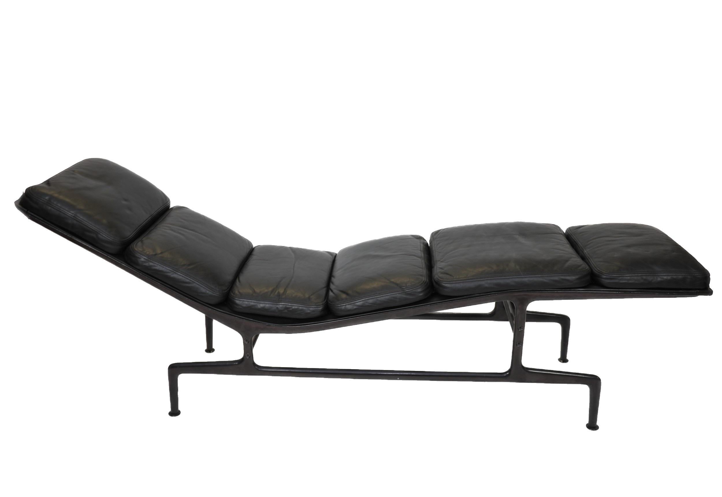 Charles and Ray Eames chaise lounge 
Manufactured by Herman Miller.
Original eggplant color frame.
Original leather sling and cushions.