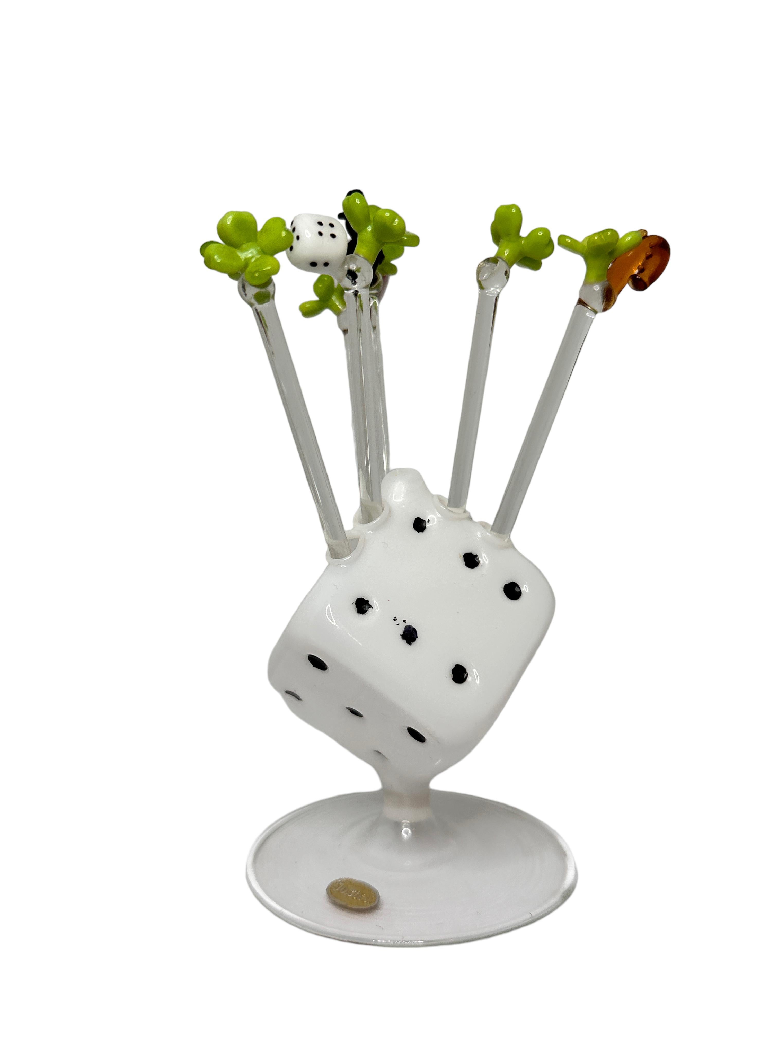 Classic early 1960s Austrian cocktail picks made of glass, showing Lucky Charms in a mouth blown glass dice stand. The total high is approx. 5 inches. The Dice Stand itself is approx. 3