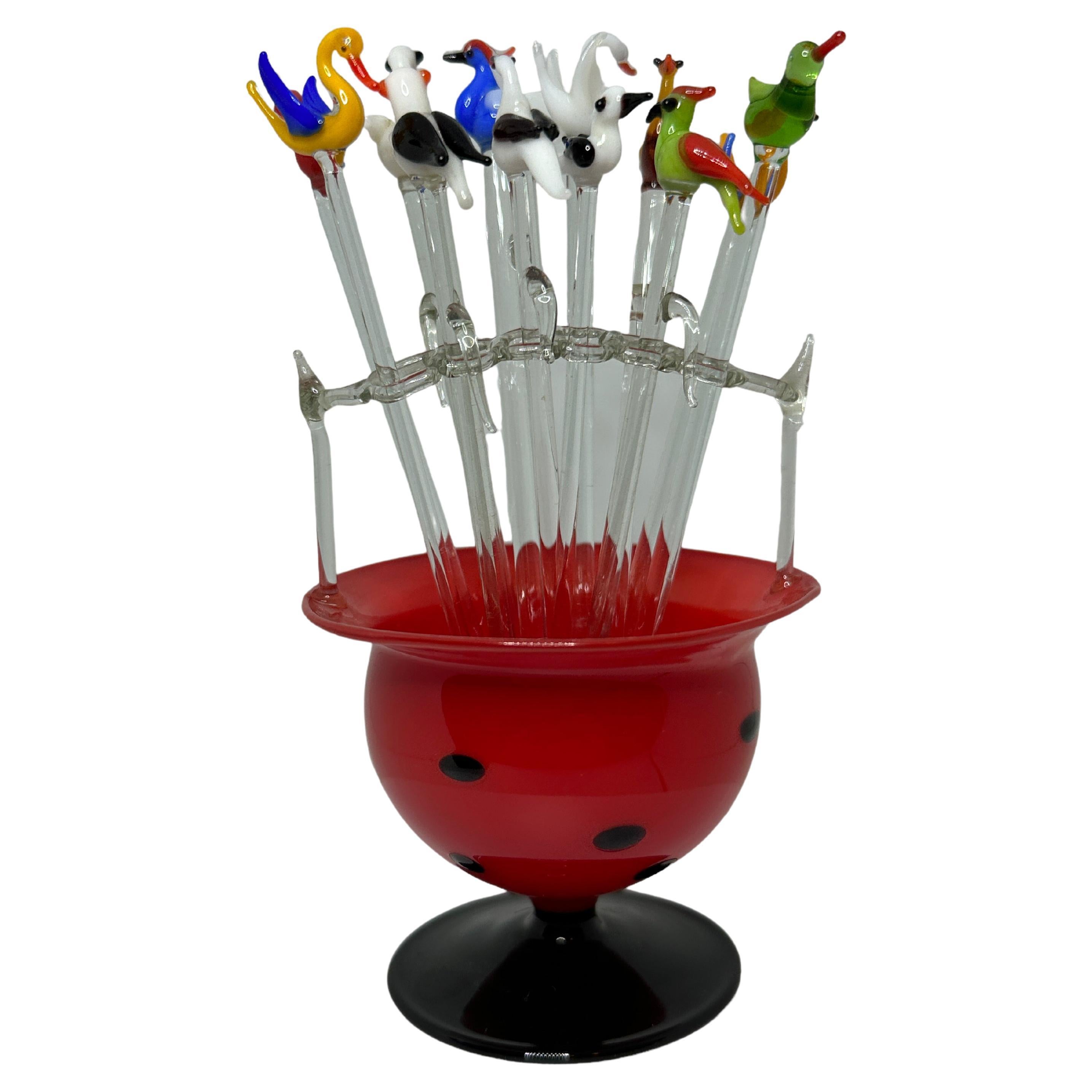 Classic early 1920s Austrian cocktail picks made of glass, showing different birds in a mouth blown glass stand. The total high is approx. 5.13 inches. The Stand itself is approx. 3.5