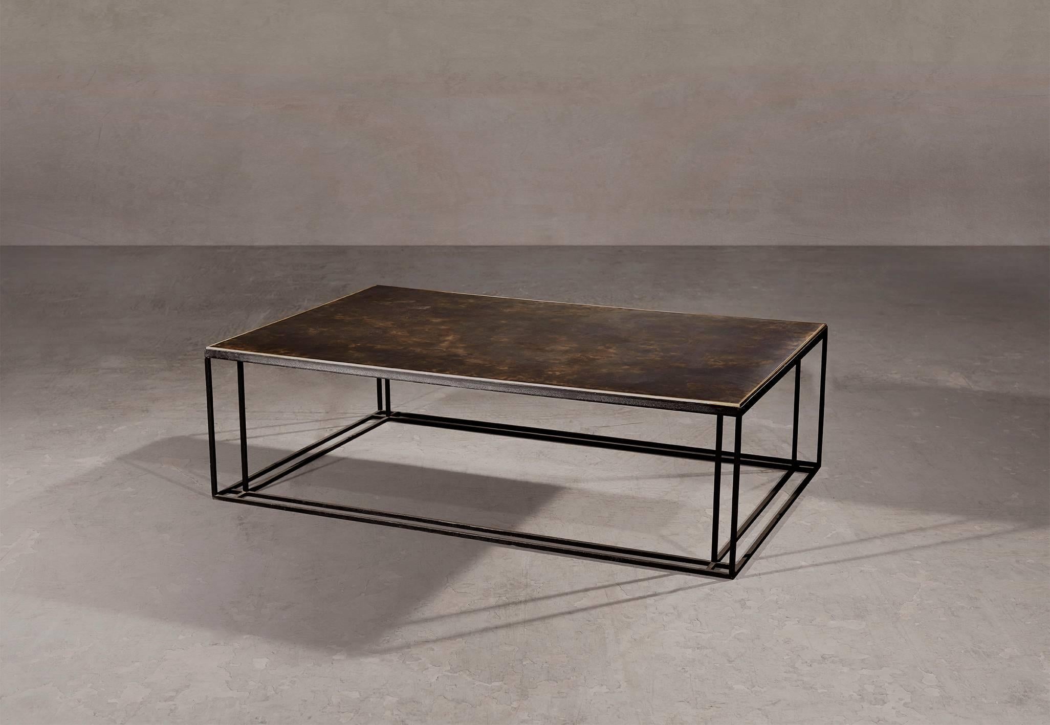 A coffee table in blackened steel and patinated brass, with a polished brass trim. Hand crafted to order in the North. Bespoke finishes and sizes are available.

Measures: 140cm width x 90cm depth x 35cm height.
Custom finishes and sizes