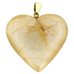 BINDER Ciondolo a forma di cuore in oro 18 carati di cristallo di rocca con inclusioni di rutilo
