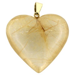 BINDER - Ciondolo in oro 18k a forma di cuore in cristallo di rocca con rutiel