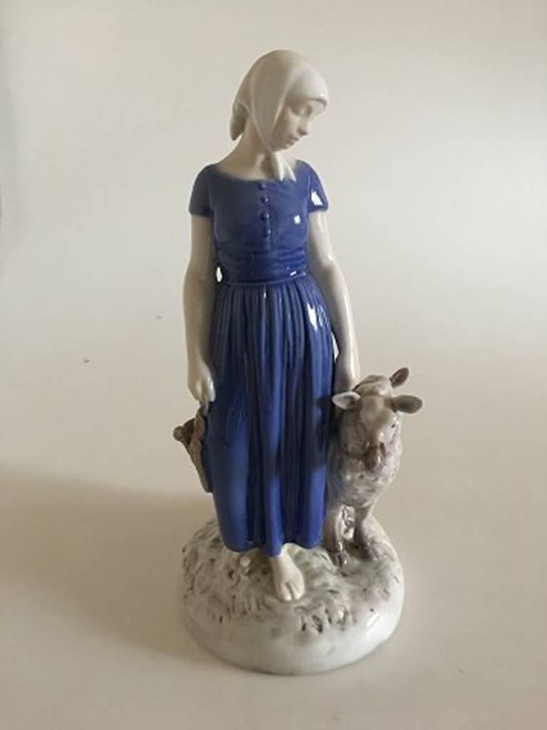 Bing & Grondahl figurine girl with sheep #2010. Measures 26 cm and is in good condition.