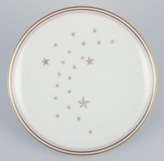Bing and Grondahl, “Milky Way". Set of eleven plates with gold decoration.
