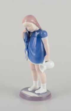 Bing and Grondahl, Porcelain figure of a girl with spilled milk.