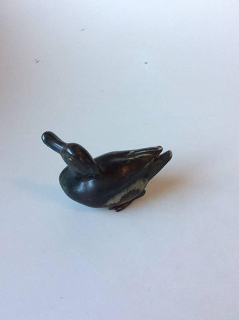 Bing & Grondahl stoneware figurine of a duck no. 7013. Measures: 13cm / 5 1/9 in.

Marked as a 3rd, because of the foot, see picture.