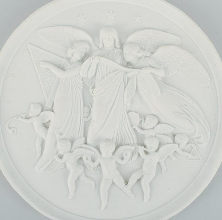 Bing & Grøndahl after Thorvaldsen. Antique biscuit wall plaque with angels in relief. 1870/80s.
Diameter: 32.0 cm.
In great condition.
Marked.
First factory quality.