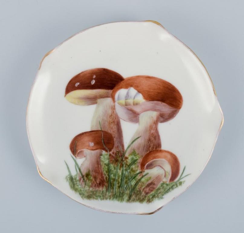 Early 20th Century Bing & Grøndahl and others. Three hand-painted dishes in porcelain. For Sale