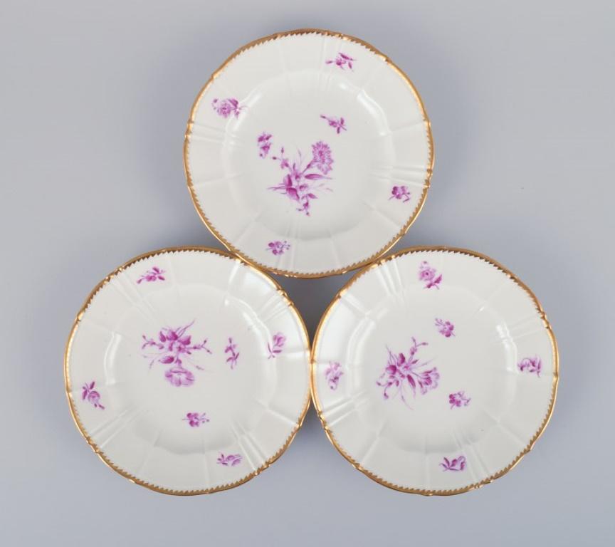 Hand-Painted Bing & Grøndahl, Denmark. A set of twelve small plates with flower decorations For Sale