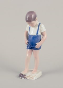 Bing & Grøndahl, Denmark. Porcelain figurine of a boy and crab.