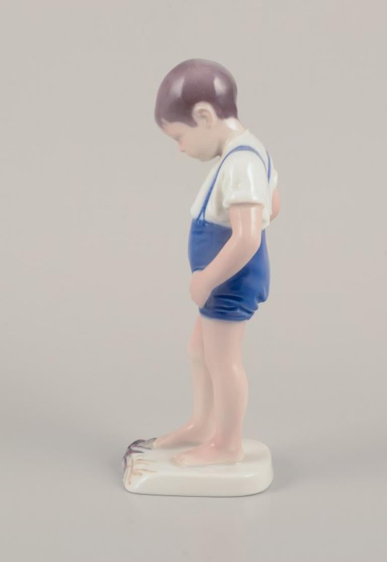 Bing & Grøndahl, Denmark. Porcelain figurine of a boy and crab. For Sale 1