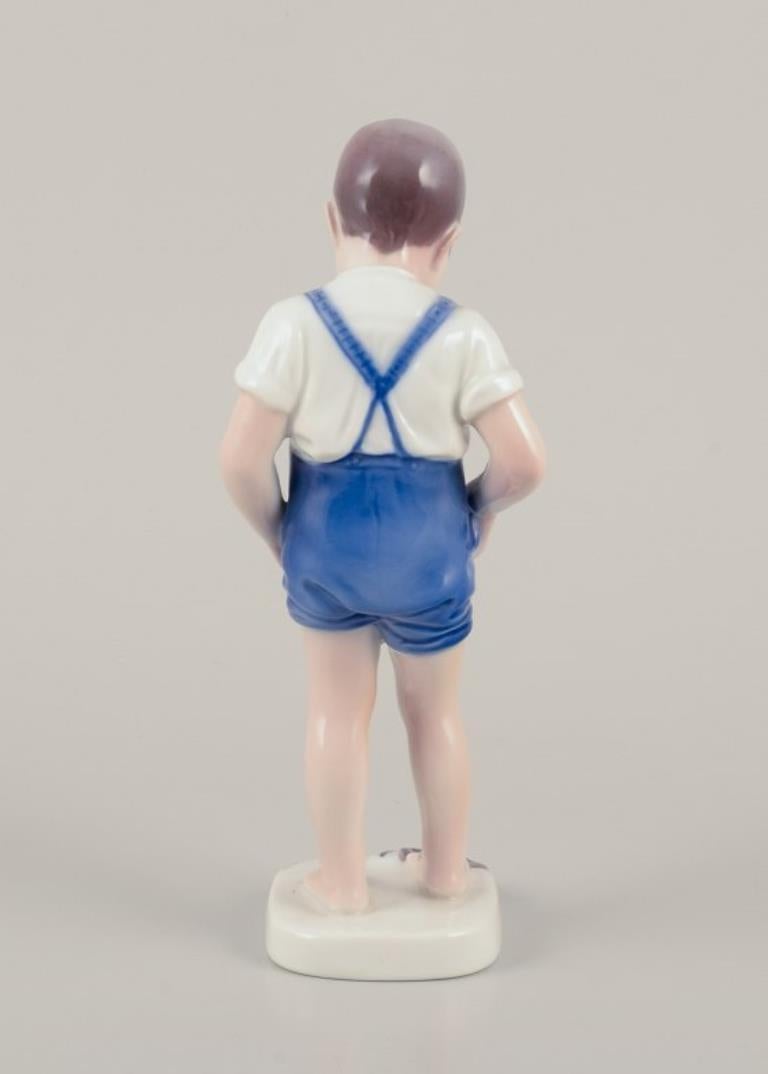 Bing & Grøndahl, Denmark. Porcelain figurine of a boy and crab. For Sale 2