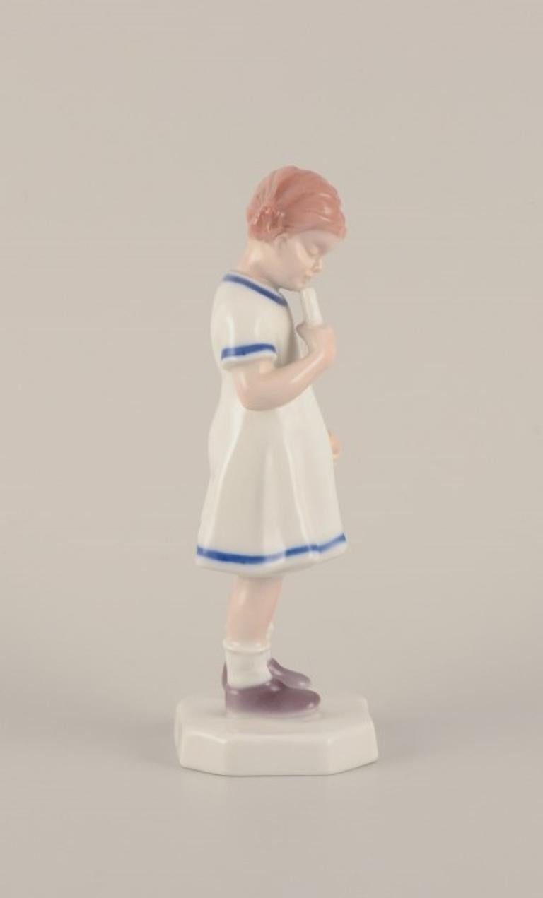 Danish Bing & Grøndahl, Denmark. Rare porcelain figurine. Young girl with ice cream.  For Sale