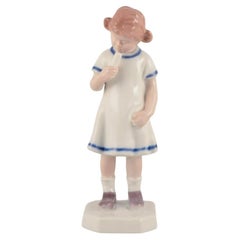 Bing & Grøndahl, Denmark. Rare porcelain figurine. Young girl with ice cream. 