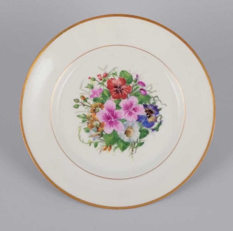 Danish Bing & Grøndahl, Denmark. Set of five porcelain plates hand-painted with flowers For Sale