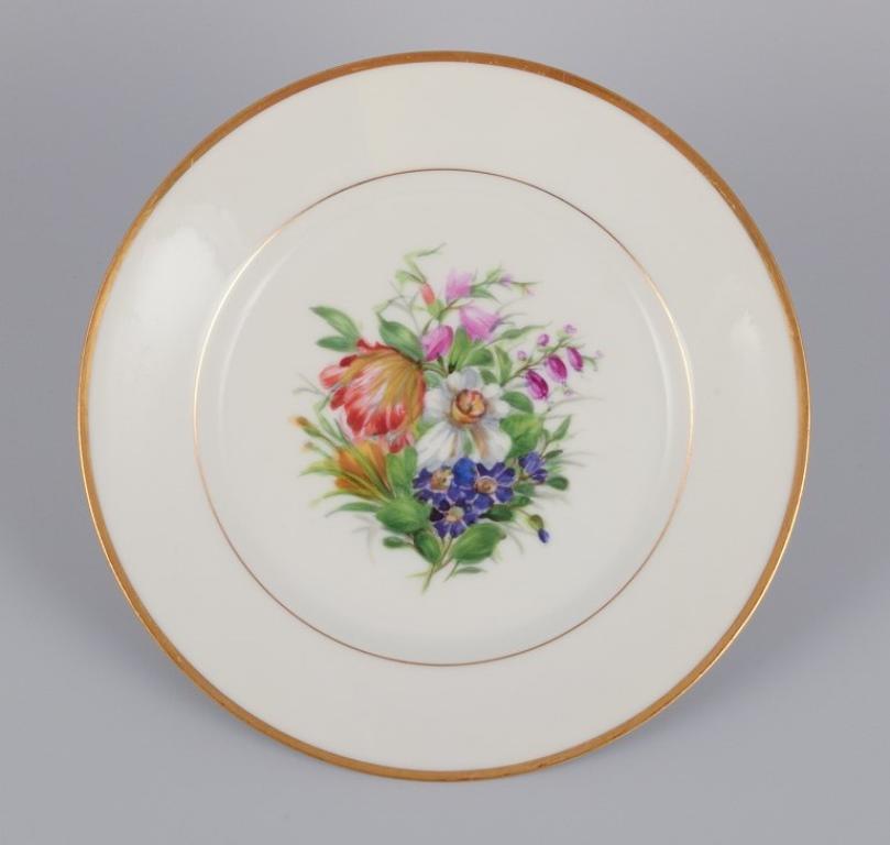 Hand-Painted Bing & Grøndahl, Denmark. Set of five porcelain plates hand-painted with flowers For Sale