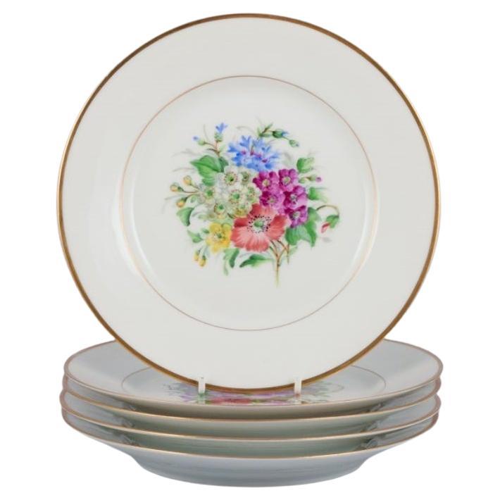 Bing & Grøndahl, Denmark. Set of five porcelain plates hand-painted with flowers For Sale