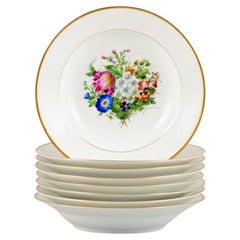 Antique Bing & Grøndahl, eight deep plates in porcelain hand-painted with flowers