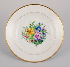 Bing & Grøndahl, four deep plates in porcelain hand-painted with flowers