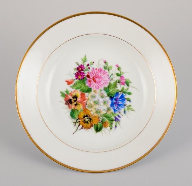 Danish Bing & Grøndahl, four deep plates in porcelain hand-painted with flowers For Sale